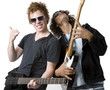 Two guys rock out with guitars