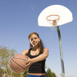 Teen with basketball at a court
