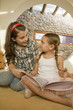 Sisters reading together