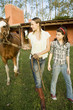 woman and girl with horse