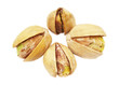 four pistachios on white background closeup