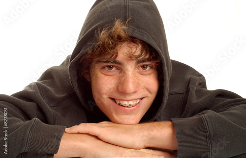 Photo: happy teen boy wearing braces on his teeth happy teen boy wearing braces on his teeth