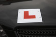 L Plate on hood of car