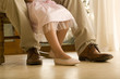 Grandfather and granddaughter's feet