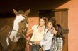 Three generation family with horse