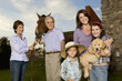 Three generation family portrait with horse and puppy