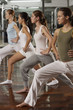 Foto: Four young women doing yoga in a gym Four young women doing yoga in a gym