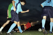 Soccer players playing soccer
