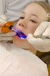 Dentist examining a girl's teeth