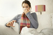 Photo: Portrait of a mid adult woman holding a bottle of nasal spray and suffering from cold Portrait of a mid adult woman holding a bottle of nasal spray and suffering from cold
