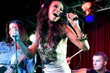 A young female singer performing