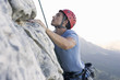 A climber climbing a rock face