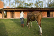 Woman walking horse