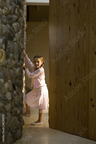 Photo: Portrait of young girl in doorway Portrait of young girl in doorway