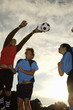 Low angle view of soccer players playing soccer