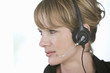 A young woman wearing an audio headset