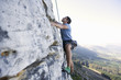 A climber climbing a rock face