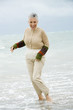 A senior woman on a beach