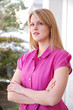young blond business woman with arms folded young blond business woman with arms folded