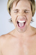 A male nude, portrait, screaming
