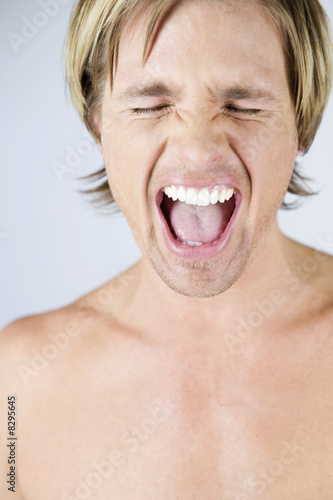 Photo: A male nude, portrait, screaming A male nude, portrait, screaming