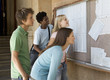 A group of students checking their exam results