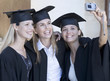 Foto: Three graduates celebrating Three graduates celebrating