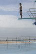 A diver standing on a diving board