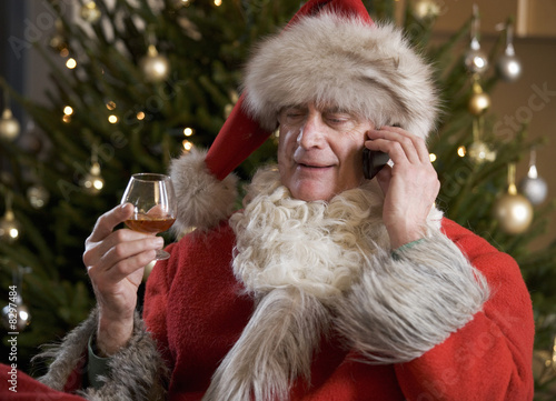 Photo: Father Christmas/Santa Claus relaxing after a hard days work Father Christmas/Santa Claus relaxing after a hard days work