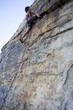 A climber climbing a rock face