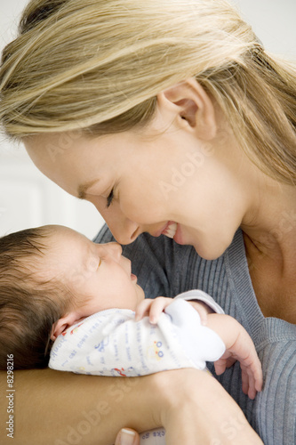 Photo: Mother holding her young baby Mother holding her young baby