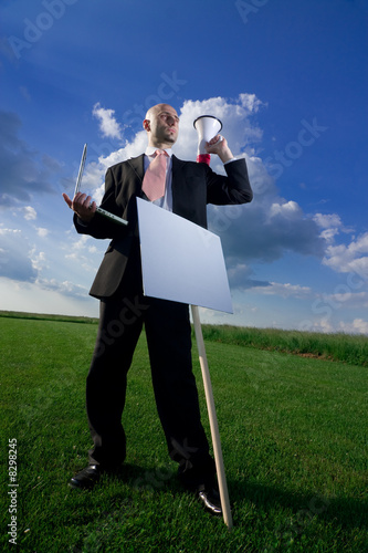Photo: Business Man with a Sign Business Man with a Sign