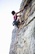 A climber climbing a rock face