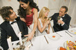 Two couples at the dining table in a restaurant