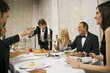 Mature man having dinner with his friends
