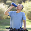 A senior man cycling