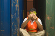 Dock worker holding a sandwich in front of his face