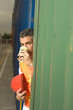 Portrait of a dock worker drinking coffee and holding a hardhat