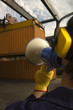 Crane lifting a cargo container in a Shipyard
