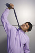 Businessman hanging himself with necktie