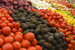 Photo: Selection of tomatoes, avocados and red onions on display on market stall (full frame) Selection of tomatoes, avocados and red onions on display on market stall (full frame)