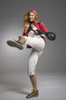 Young woman kickboxing, studio shot