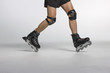 Cropped view of man inline skating, studio shot