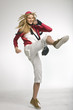 Young woman kickboxing, studio shot
