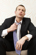 Businessman loosening his tie