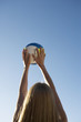 A woman playing beach volleyball