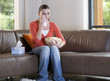 A teenage girl watching television