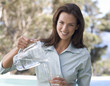 Woman pouring a glass of water
