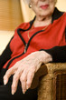 An elderly woman sitting in a chair