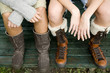 Two teenage girls wearing boots